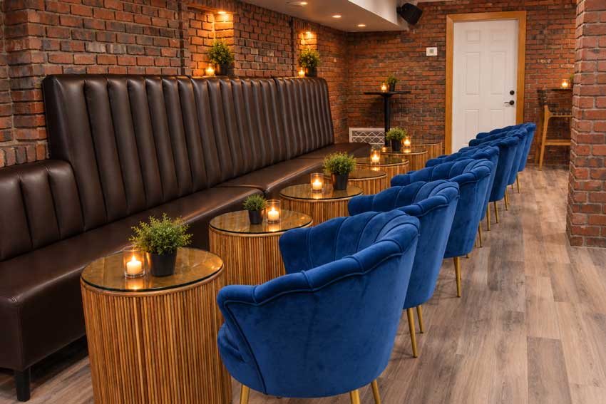 Table seating close to the stage in The Comedy Room